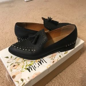 Black studded loafers